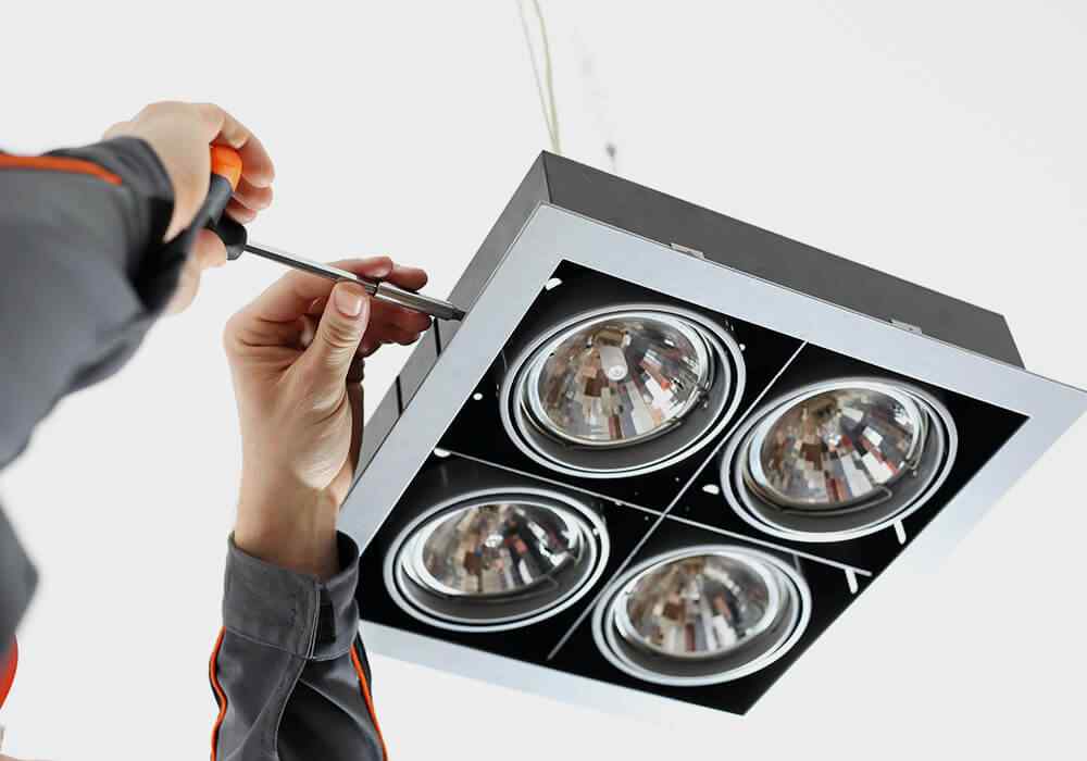 Electrician installing LED lighting